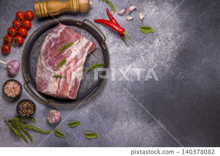 Raw pork shoulder preparing with herbs and spices Raw pork shoulder preparing with herbs and spices 140378082