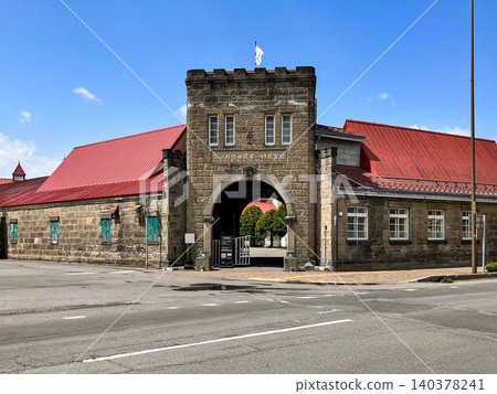 Nikka Whisky Yoichi Distillery, stone main gate arch, Yoichi-cho, Yoichi-gun, Hokkaido, clear weather. Nikka Whisky Yoichi Distillery, stone main gate arch, Yoichi-cho, Yoichi-gun, Hokkaido, clear weather. 140378241