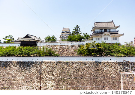 A beautiful view of Fukuyama Castle's keep, moon-viewing tower, and high stone walls (angled from the Shinkansen Fukuyama Station platform). A beautiful view of Fukuyama Castle's keep, moon-viewing tower, and high stone walls (angled from the Shinkansen Fukuyama Station platform). 140378847