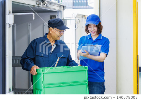 Female driver working in a warehouse Female driver working in a warehouse 140379005