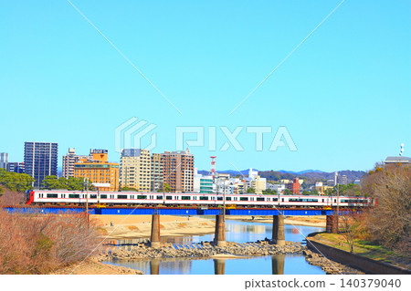 Okazaki City, Aichi Prefecture, scenery of the townscape of Okazaki City and Meitetsu train Okazaki City, Aichi Prefecture, scenery of the townscape of Okazaki City and Meitetsu train 140379040