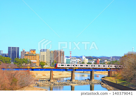 Okazaki City, Aichi Prefecture, scenery of the townscape of Okazaki City and Meitetsu train Okazaki City, Aichi Prefecture, scenery of the townscape of Okazaki City and Meitetsu train 140379041