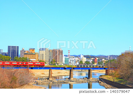 Okazaki City, Aichi Prefecture, scenery of the townscape of Okazaki City and Meitetsu train Okazaki City, Aichi Prefecture, scenery of the townscape of Okazaki City and Meitetsu train 140379047
