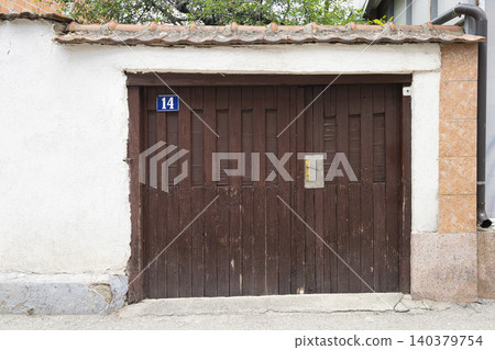 An old locked double door An old locked double door 140379754