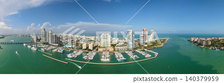 Panorama of Miami Beach. Aerial view of South Pointe Park and South Beach in Miami Beach. Miami skyline on a sunny day. Panorama of Miami Beach. Aerial view of South Pointe Park and South Beach in Miami Beach. Miami skyline on a sunny day. 140379959