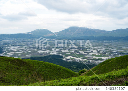 Aso Mountain Range and rice paddies in the caldera basin as seen from Daikanbo, Kumamoto Prefecture Aso Mountain Range and rice paddies in the caldera basin as seen from Daikanbo, Kumamoto Prefecture 140380107