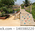 Outdoor Adventure Playground With Wooden Climbing Structure In Tropical Park 140380220