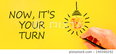Now it's your turn symbol. Concept words Now it's your turn on beautiful yellow paper. Beautiful yellow background. Businessman hand Business Now it's your turn motivational support concept Copy space 140380292