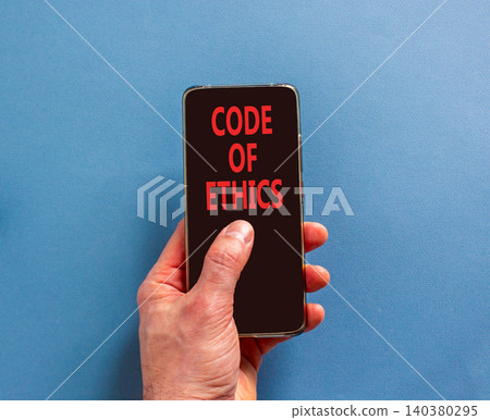 Code of ethics words symbol. Concept words Code of ethics on beautiful black mobile phone screen. Beautiful blue background. Businessman hand. Business Code of ethics concept. Copy space. Code of ethics words symbol. Concept words Code of ethics on beautiful black mobile phone screen. Beautiful blue background. Businessman hand. Business Code of ethics concept. Copy space. 140380295