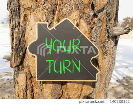 Your turn words symbol. Concept words Your turn on beautiful black blackboard. Beautiful old tree background. Business your turn motivational support concept. Copy space. 140380361