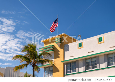 Ocean drive. Miami Beach in Ocean Drive Florida. Art Deco building architecture. Architectural building. Art deco. Architectural district Art Deco. Modern building of Miami beach with USA flag Ocean drive. Miami Beach in Ocean Drive Florida. Art Deco building architecture. Architectural building. Art deco. Architectural district Art Deco. Modern building of Miami beach with USA flag 140380632