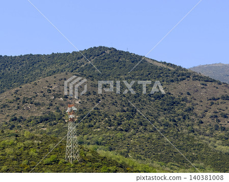 Mountain landscape with transmission tower Mountain landscape with transmission tower 140381008