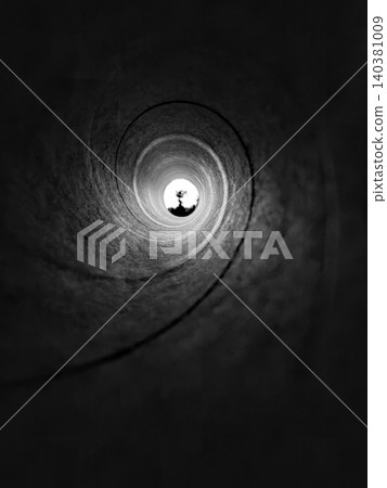 Looking through a dark tunnel toward a bright opening Looking through a dark tunnel toward a bright opening 140381009