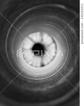 Monochrome circular tunnel with dark center 140381011