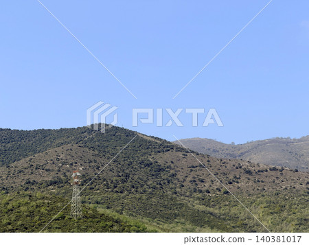 Mountain landscape with transmission tower Mountain landscape with transmission tower 140381017