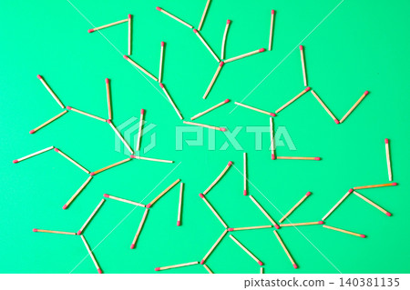 Wooden matchsticks scattered on a color background, like network concept. Wooden matchsticks scattered on a color background, like network concept. 140381135