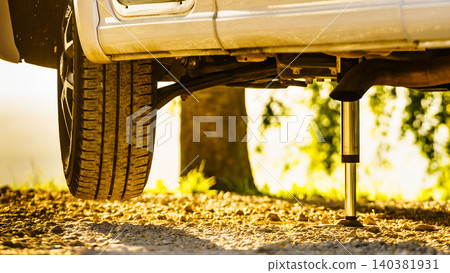 Camper with hydraulic leg in use. Rv levelling system Camper with hydraulic leg in use. Rv levelling system 140381931