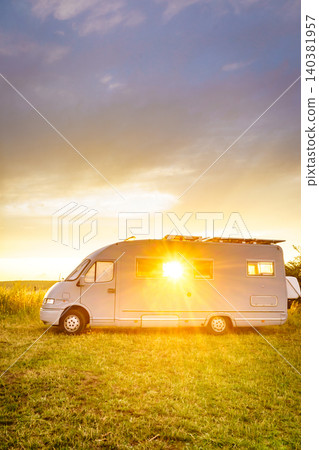 Sunset sky over caravan camping on nature. Summer trip. 140381957