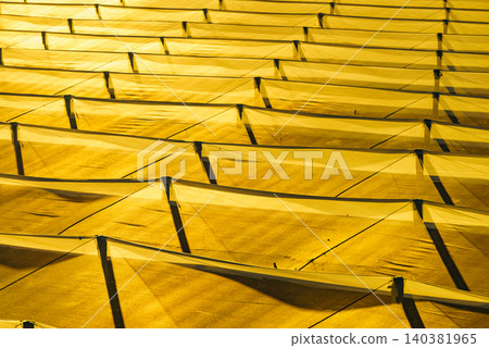 Greenhouses for growing plants and commercial agriculture at sunset Greenhouses for growing plants and commercial agriculture at sunset 140381965