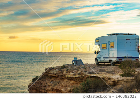 Caravan recreational vehicle camping on sea shore. 140382022