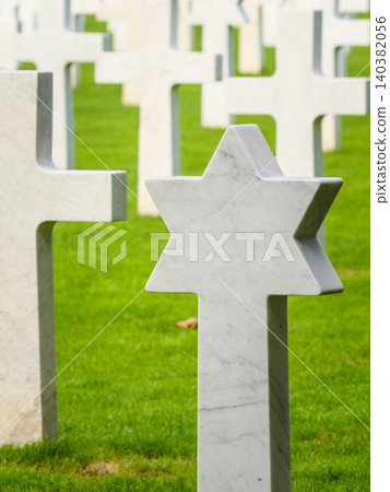 St. Mihiel American Cemetery in Thiaucourt France. White crosses and gravestone with a star of David St. Mihiel American Cemetery in Thiaucourt France. White crosses and gravestone with a star of David 140382056