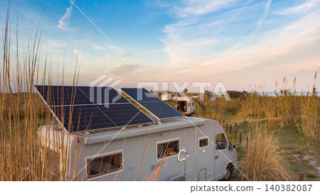 Caravan with tilt solar panels on roof. Aerial view. Caravan with tilt solar panels on roof. Aerial view. 140382087