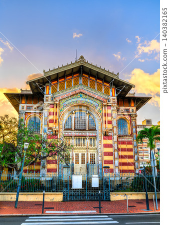 The vibrant facade of the Schoelcher Library at sunset in Fort-de-France, Martinique, showcasing its unique eclectic architecture and colorful details. The vibrant facade of the Schoelcher Library at sunset in Fort-de-France, Martinique, showcasing its unique eclectic architecture and colorful details. 140382165