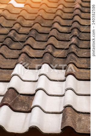 Roofing tiles resting in sunlight at a construction site Roofing tiles resting in sunlight at a construction site 140382586