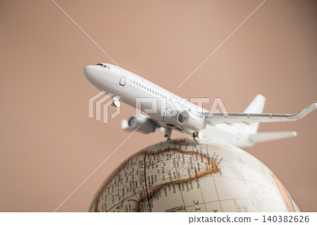 Airplane on globe close up, international travel tourism transportation and global destination concept Airplane on globe close up, international travel tourism transportation and global destination concept 140382626