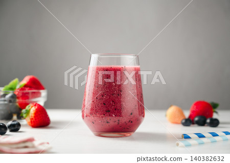Berry smoothie in a glass, made from fresh fruits, healthy eating, copy space Berry smoothie in a glass, made from fresh fruits, healthy eating, copy space 140382632