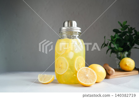 Homemade lemonade with lemon slices and ice in glass jar, refreshing summer drink concept Homemade lemonade with lemon slices and ice in glass jar, refreshing summer drink concept 140382719