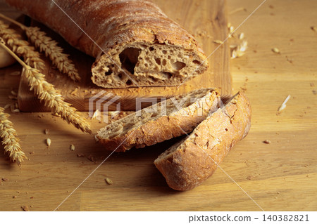Ciabatta on a wooden table. Ciabatta on a wooden table. 140382821