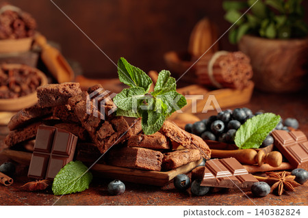 Brownie with blueberries and mint. Brownie with blueberries and mint. 140382824