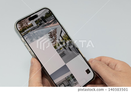 Browsing premium real estate listings online Browsing premium real estate listings online 140383501