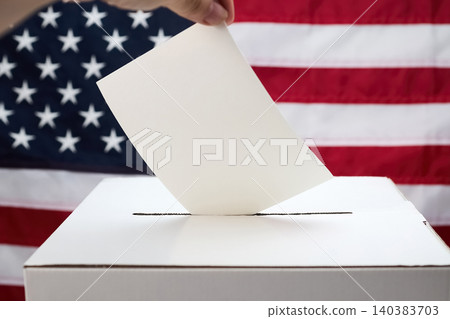 Hand casting ballot into a ballot box with american flag Hand casting ballot into a ballot box with american flag 140383703