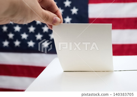 Hand casting vote into ballot box respecting democracy Hand casting vote into ballot box respecting democracy 140383705