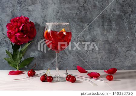 Royal lemonade with cherry, tequila, gin, rum, and ice, bar and party concept with peony flowers, restaurant advertising card, elegant background, minimalist still life with flowers and alcohol. Royal lemonade with cherry, tequila, gin, rum, and ice, bar and party concept with peony flowers, restaurant advertising card, elegant background, minimalist still life with flowers and alcohol. 140383720