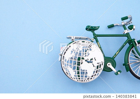 World bicycle day. Green bicycle with globe wheel promoting sustainable travel World bicycle day. Green bicycle with globe wheel promoting sustainable travel 140383841