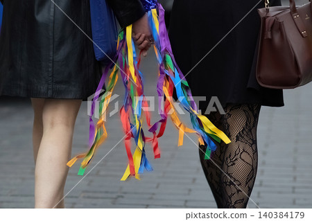 People holding hands showing lgbt pride ribbons People holding hands showing lgbt pride ribbons 140384179