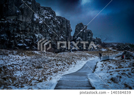 Snowy road and rocky cliffs of a canyon Snowy road and rocky cliffs of a canyon 140384839