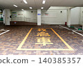 A view of the emergency entrance and parking area at a hospital supporting emergency medical care. 140385357