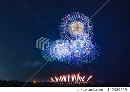 Large fireworks blooming in the night sky Large fireworks blooming in the night sky 140386859