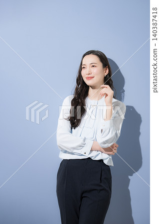 A confident, trustworthy, and attractive business image of a handsome woman: Think with a smile. A confident, trustworthy, and attractive business image of a handsome woman: Think with a smile. 140387418