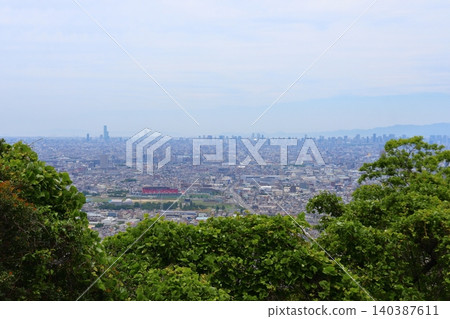 A view of Osaka cityscape from the Nukata Observatory in Hiraoka Park (Higashi-Osaka City, Osaka Prefecture) 140387611