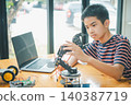 Asian boy learning and studying the work of technology robots.homeschool and science for tech project. playing childhood kids hobby leisure lifestyle people toys robotics technology. 140387719