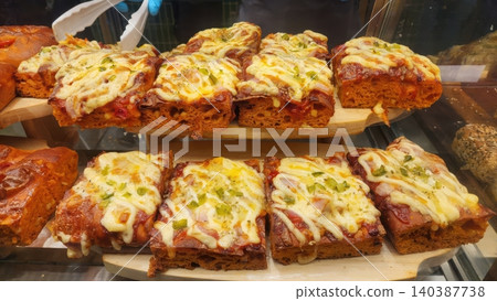 Delicious Slices of Thick Crust Cheese Pizza with Tomato Sauce on Wooden Tray 140387738