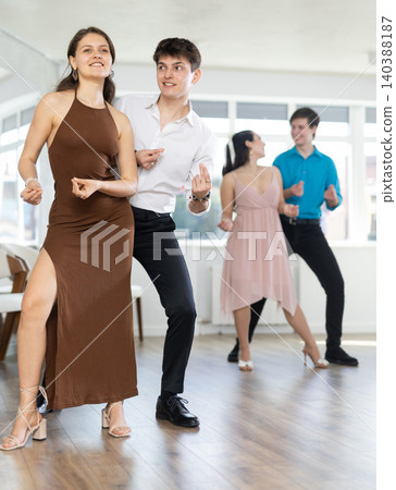 Couple young woman and man dancing twist Couple young woman and man dancing twist 140388187