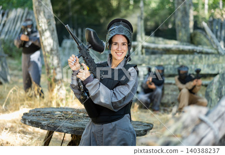 Portrait of cheerful woman paintball player Portrait of cheerful woman paintball player 140388237