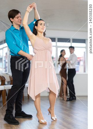 Couple young woman and man dancing waltz Couple young woman and man dancing waltz 140388280
