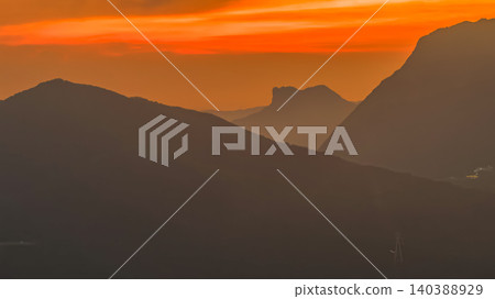 July 8 2022 Hong Kong mountains dramatic sunset rays 140388929